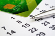 © vvlink - Credit card with a pen and dates of the month