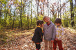 © RooM The Agency - Three happy children playing in the woods