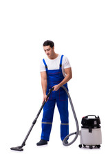 Wall Mural - Man in coveralls doing vacuum cleaning on white