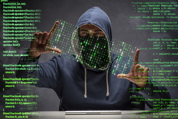 young hacker in data security concept