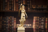 Fototapeta  - Antique statue of justice, law, books background