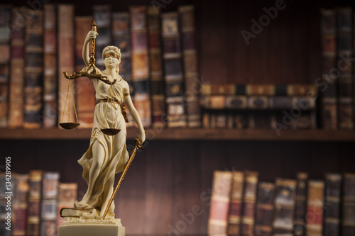 Fotografia Antique statue of justice, law, books background