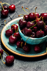 Cherries in a bowl with water drops 