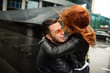 © Wedding photography - Crazy love, bearded man hugs redhead woman with windy hair