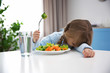 © Africa Studio - Small girl refusing to eat vegetable salad