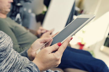 Wall Mural - man and woman using electronic devices