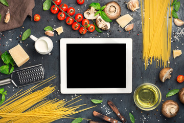 Canvas Print - Tablet with copy space with ingredients for cooking Italian past