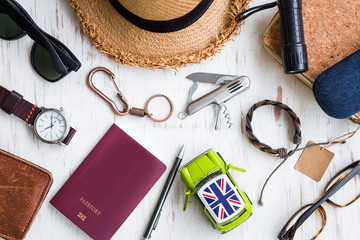 Wall Mural - Travel preparations concept, men's accessories and passport on white rustic wooden background