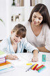 © LStockStudio - Mother and Daughter Doing Homework Together