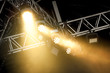 stage spotlights through smoke