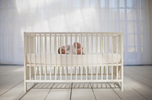 Baby Boy Laying In Crib