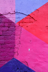 Colorful (purple, blue and pink) brick wall as background, texture