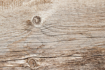 Texture of natural old weathered wooden board with crack lines, curves, swirls. Close-up. Vintage background