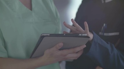 Wall Mural - group of medical staff at hospital, doctors team checking patient informations on tablet computer