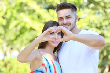 Canvas Print - Couple making heart shape with hands