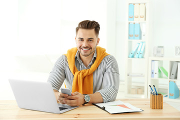 Canvas Print - Handsome man working in office