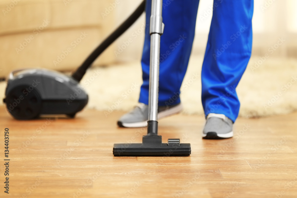 Close Up Of Man Hoovering Floor With Vacuum Cleaner Foto Poster