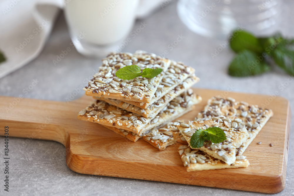 Delicious cereal cookies on cutting board, closeup