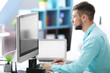 © Africa Studio - Handsome young programmer working at home