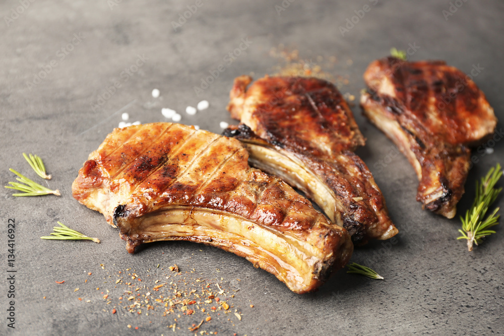 Grilled meat on grey background