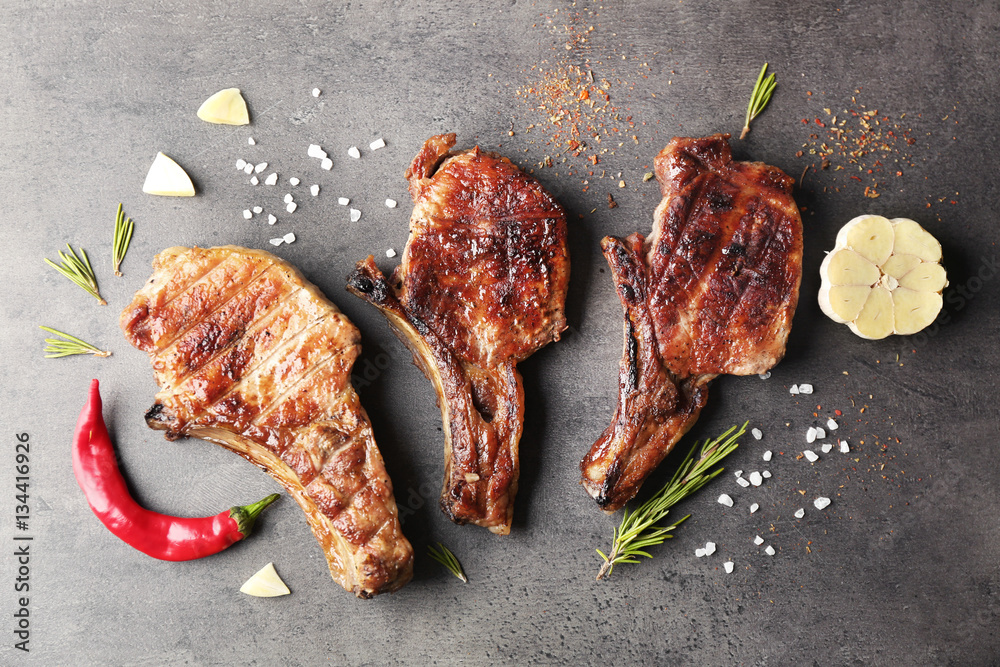 Grilled meat on grey background