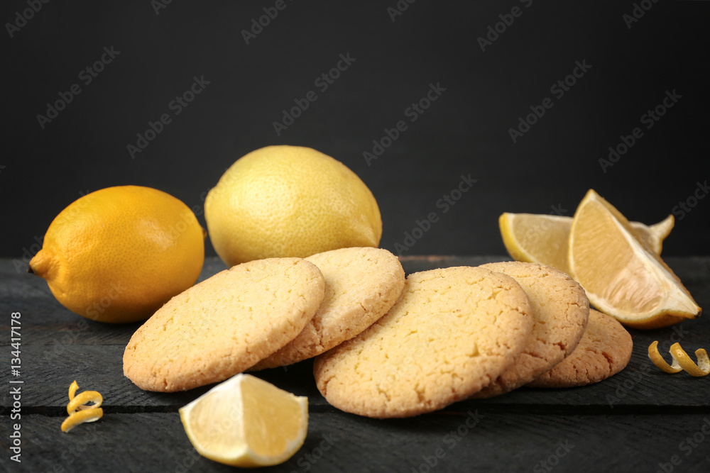 Lemon cookies with fresh fruit on wooden table