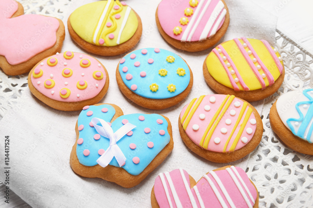 Delicious colourful Easter cookies on tray, closeup
