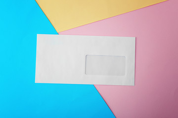 Canvas Print - Blank white envelope on color paper background