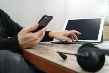 Poster -  man hand using VOIP headset with digital tablet computer dockin