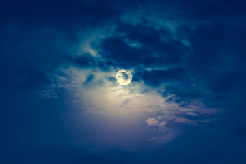 Wall Mural - nighttime sky with clouds and bright full moon with shiny.