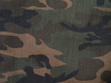Camouflage Brown And Green Denim Military Textile Background Horizontal