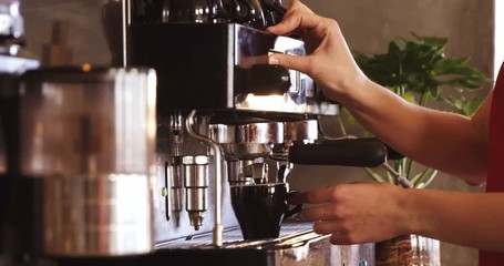 Wall Mural - Waitress making cup of coffee in cafÃ© 4k