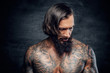 © Fxquadro - Portrait of a  man with tattooed body.