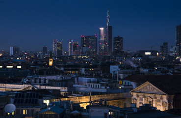 Wall Mural - Milan skyline with modern skyscrapers in Porta Nuova business district in Milan, Italy. Night view.