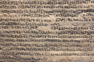 abstract old stone inscription wall at the archaeological or his