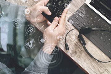 Poster - top view of man hand using VOIP headset with digital tablet comp