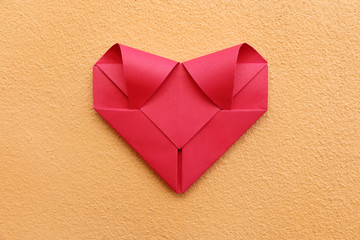 Poster - one folding red paper heart on concrete wall for valentine patte