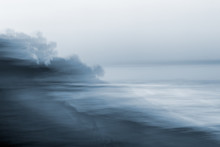 Motion Blurred Seascape. A Monotone, Blurred Seascape Made Using A Long Exposure Combined With Horizontal Panning Motion.