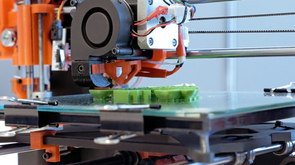 Automatic three dimensional 3d printer performs product creation. Modern 3D printing or additive manufacturing and robotic automation technology.