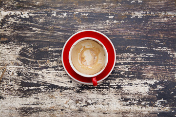 Empty of Used Red Coffee Cup on Wood Background