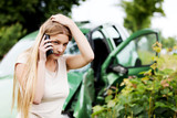 Fototapeta  - Female criver making phone calls after traffic accident.
