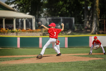Young Pitcher On The Mound In A Youth Baseball Game