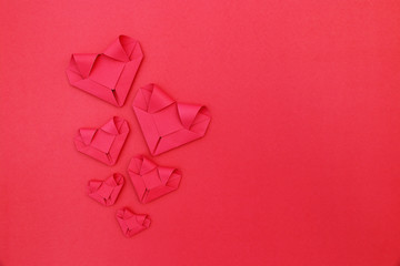 Poster - six folding red paper hearts on red for valentine pattern and ba