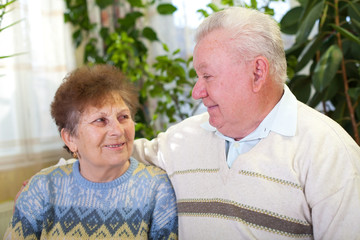 Sticker - Smiling elderly couple at home