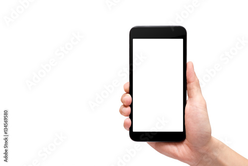 Fotografie, Obraz Hand holding black mobile phone with blank screen isolated on wh
