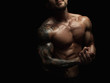 © Prostock-studio - Strong athletic man showes naked muscular body