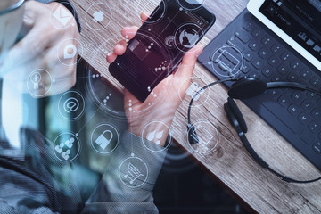 Poster - top view of man hand using VOIP headset with digital tablet comp