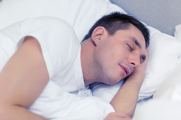 Wall Mural - handsome man sleeping in bed