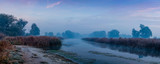 Fototapeta Tęcza - panorama of sunrise over the river and fog
