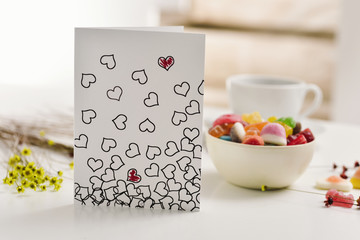 Wall Mural - postcard with some hearts on a table